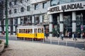 LISBON, PORTUGAL - December 31, 2017: Street view with famous old historic tourist yellow tram. Famous vintage tourist Royalty Free Stock Photo