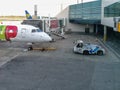 Exterior view of the runway and lift and maintenance of aircraft at Lisbon airport with front TAP airplane, cargo working