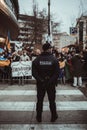 Policeman in front of protest action Royalty Free Stock Photo