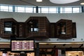 View of TAP lounge in the airport with stores and display board of departures and arrivals Royalty Free Stock Photo