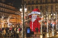 Lisbon, Portugal - 12/26/18: Giant Santa statue in the middle of the street in Baixa Chiado Royalty Free Stock Photo