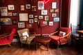 Hotel lobby in retro style with vintage furniture and red walls with photoframes