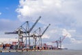 Lisbon, Portugal - International Port of Lisbon in the Tagus River with cranes and shipping containers Royalty Free Stock Photo