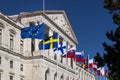 Detail of the facade of the Assembleia da Republica Portuguese Parliament, with the European union countries flags raised in ord