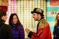 Lisbon, Portugal - January, 2018. A shop worker in a steampunk uniform tells customers about the conservation of tuna.