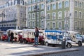 Tuk Tuk drivers wait for passengers and tourists for taxi rides near Rossio Square