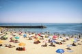 LISBON, PORTUGAL - JULY 26, 2016: Cascais beach near Lisbon in Portugal packed full of tourists and visitors