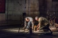 Mettalurgic workers working at night on the pavement in Lisbon