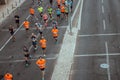 Marathon on the streets of Lisbon. Active people. Group of runners in the city. Urban sport. Competition and healthy activity.