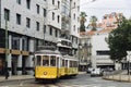 Iconic, yellow tram 28 standing near Hotel Mundial in Lisbon, Portugal Royalty Free Stock Photo