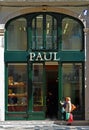 Lady shopper outside Paul Bakery and Cafe Rua Augusta Lisbon Portugal.