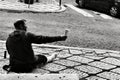Man begging on the street in Lisbon