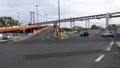 Cars drive on onramp heading towards 25 de Abril Bridge in Lisbon, Portugal