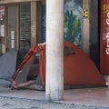 Homeless man in a tent in Lisbon, Portugal as the city becomes increasingly unaffordable for many