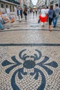 People walk on Rua Augusta street