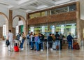 Passengers queue to purchase tickets at Lisbon`s Santa Apolonia train station connecting Portugal`s inter-city train Royalty Free Stock Photo