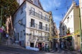 Street scene in the Alfama neighborhood during the Popular Saints festivities, with people in front of a traditional restaurant, i Royalty Free Stock Photo