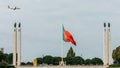 Flag of Portugal at Eduardo VII Park juxtapositioned against an aircraft belonging to TAP