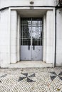 Gray metal door and typical Portuguese facade in Lisbon Royalty Free Stock Photo