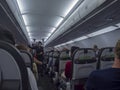 Lisbon, Portugal, October 30, 2021: Interior of commercial TAP airline airplane, passengers sitting on the economy class