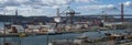 Panoramic view of a container ship unloading at the dock in the port of the city of Lisbon Royalty Free Stock Photo