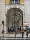 Lisbon, Portugal, October 30, 2021: People walking and shopping in market stands at Archway surrounding Praca do