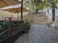 Lisbon, Portugal, October 30, 2021: street with stairs in Baixa at Lisbon center, Autumn rainy evening