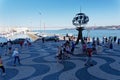 Tourists visit the Belem Monument to the Discoveries, Lisbon, Portugal.