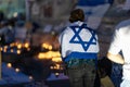 Lisbon, Portugal October 10, 2023. A woman at the memorial to the fallen Israelis in October 2023 at dusk, , with the