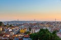Lisbon, Portugal old town skyline with view on river Tagus and bridge on sunset Royalty Free Stock Photo