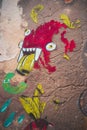 Lisbon, Portugal - 01/03/19: Red Monster Graffiti in downtown Bairro Alto