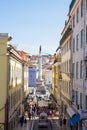 LISBON, PORTUGAL - SEPTEMBER 13, 2019: Calcada do Carmo street and Column and statue of Dom Pedro IV at the Rossio