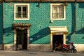 Lisbon, Portugal - Septmember 19, 2016: Tiled facade and girls drinking coffee