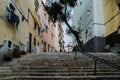 Lisbon, Portugal. Stone stairs with railings among colourful old houses in Alfama district Royalty Free Stock Photo