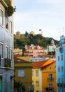 Lisbon, Portugal: street in Alfama with a view to the Castle hill