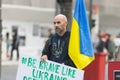 10-29-2022 LISBON, PORTUGAL: Ukrainian protest in Lisbon - a Ukrainian man holds a poster with a hashtag