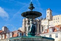 Lisbon, Rossio Square fountain and colorful historic buildings of historic city center