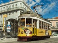 Lisbon`s legendary yellow tram. Streets of the Portuguese capital.