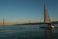 Lisbon sailing boat and 25 de Abril Bridge, Tagus river