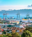 Lisbon skyline, cranes and cargo containers Royalty Free Stock Photo