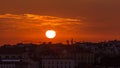 Lisbon at sunset aerial skyline of city centre with red roofs at Autumn evening timelapse, Portugal