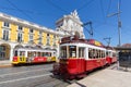 Lisbon Trams public transport transit transportation traffic at the triumphal arch in Portugal