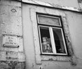 Lisbon. Figure at the window Royalty Free Stock Photo