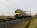 An NMBS train (the MS08 series) drives away from Lissewege station.