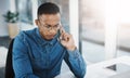 Always listen attentively to client requests and issues. a young businessman with a serious look on his face taking a Royalty Free Stock Photo