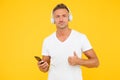 Listen good song. Guy modern user mobile application. Favorite music playlist. Music subscription. Mature man listen Royalty Free Stock Photo