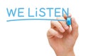 We Listen Handwritten With Blue Marker Royalty Free Stock Photo