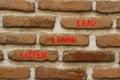 Listen learn lead symbol. Concept word Listen Learn Lead on beautiful red brown bricks. Beautiful red brown brickwall background. Royalty Free Stock Photo