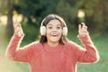 Listen in style. Little girl child wearing headphones. Happy child enjoy listening to music on the go. Adorable little Royalty Free Stock Photo