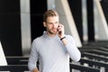 Listen to me. Man beard walks with smartphone, urban background. Man with beard serious face talk smartphone. Guy Royalty Free Stock Photo